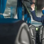 Charter bus interior amenities including overhead storage and seating